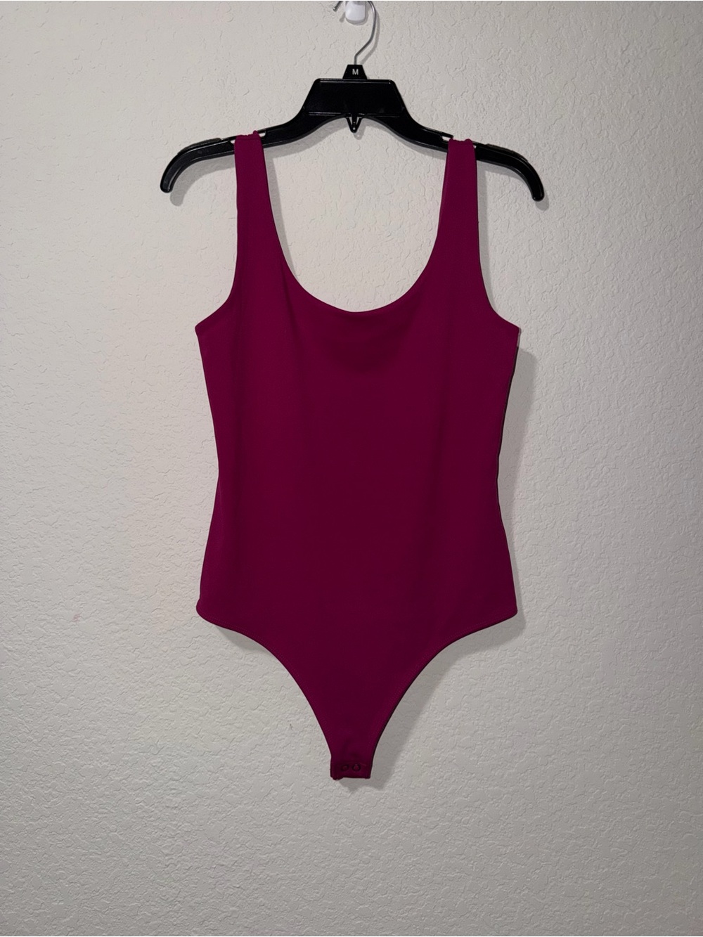 Express Sleeveless One-Piece Bodysuit in Magenta